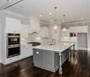 Open kitchen with Stainless Steel appliances in Sandy Springs built by Waterford Homes